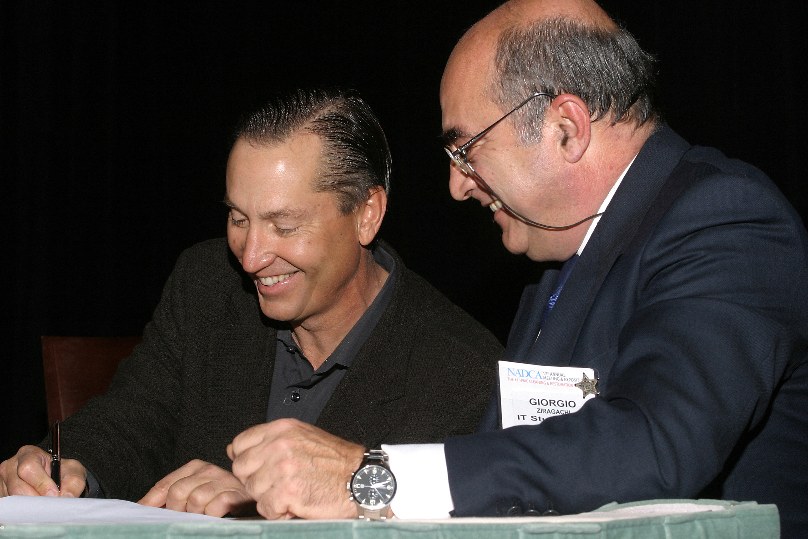 Past NADCA president Bill Lundquist and past AIISA president, Giorgio Ziragachi signing the official partnership agreement on March 8, 2006, in Dallas, TX.